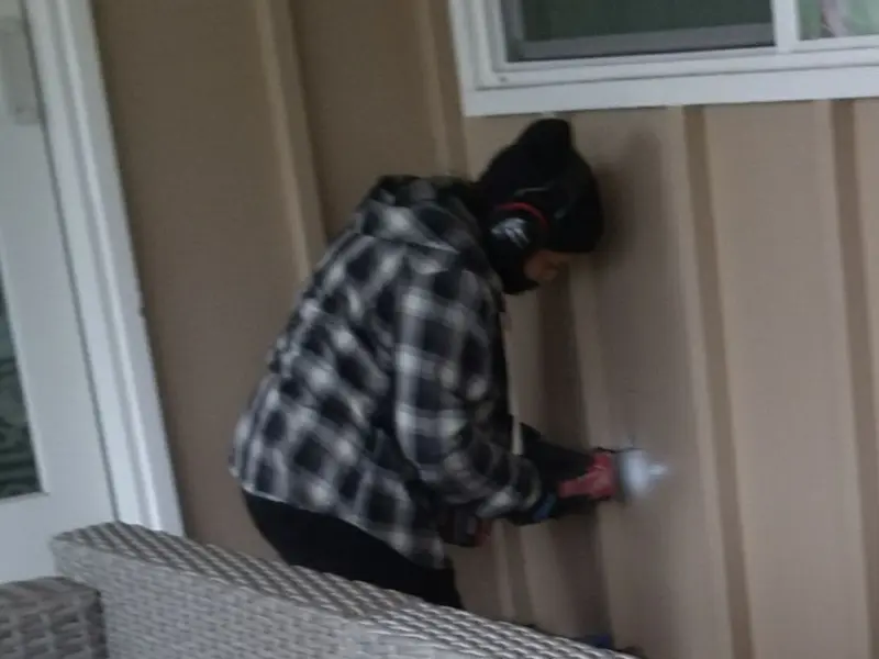 Professional electrician installing an exterior outlet in Oakland